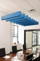 Blue felt acoustic beams suspended from ceiling in staggered arrangement above conference table.