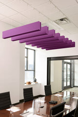 Purple felt acoustic beams suspended from ceiling in staggered arrangement above conference table.