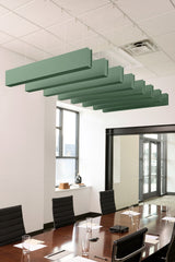 Seven green felt acoustic beams suspended horizontally from white drop ceiling in conference room.