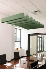 Green felt acoustic beams suspended horizontally from ceiling in stepped arrangement above conference table.