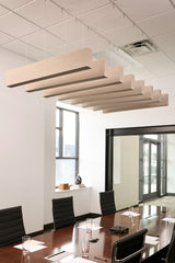 Light wood grain acoustic beams suspended from white drop ceiling in modern office conference room.