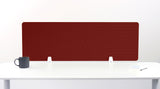 Burgundy desk divider with geometric arc pattern, positioned on white desk with mug and notepad.
