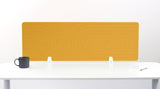 Gold desk divider with geometric line pattern, positioned on white desk with dark mug and notepad.