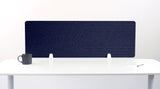 Navy blue desk divider with geometric line pattern and white mounting brackets on white surface.