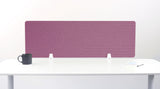 Purple desk divider with geometric arc pattern standing on white desk with support brackets.