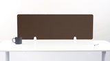 Brown desk divider with geometric arc pattern, displayed on white desk with small supports.