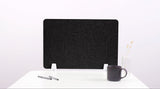 Black desk divider with wave-shaped cutouts, positioned upright on white base with white feet.
