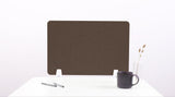 Brown wavy desk divider with rounded cutouts, standing on white supports on a desk with mug and vase.