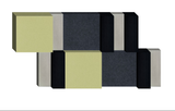 3D geometric design with interlocking rectangular blocks in pale yellow, charcoal gray, black, and light gray.