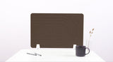 Brown desk divider with geometric arc pattern, standing upright on white supports on desk with mug and supplies.