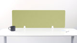 Sage green desk divider with chevron quilted pattern mounted on white desk with metal brackets.