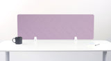 Purple desk divider with chevron quilting pattern mounted on white desk with metal brackets.