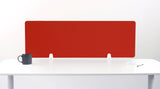 Red desk divider with quilted pattern mounted on white desk with two white brackets.