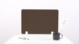 Brown fabric desk divider with chevron pattern and white mounting feet on white desk with pen, mug, and vase.