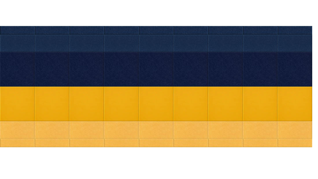 Rectangular agricultural building with blue top section, gold middle band, and tan bottom section with grid panel divisions.