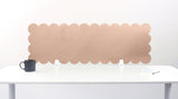 Scalloped beige wall panel on a white background