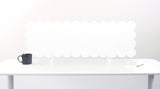 White desk with a black mug and white lamp on a white background