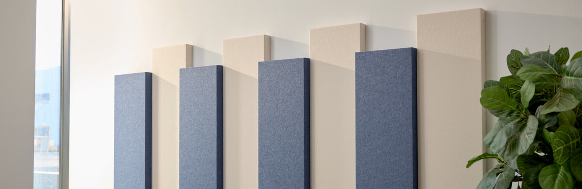 Blue and cream colored medium sized acoustic 3D boxes
