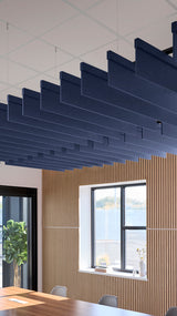 Dark blue acoustic ceiling blade baffles suspended from the ceiling, installed in a conference room. Felt Right's acoustic blade baffles absorb 65% of sound waves, making office spaces quieter and feel more calm.