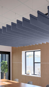 Indigo blue acoustic ceiling blade baffles suspended from the ceiling, installed in a conference room. Felt Right's acoustic blade baffles absorb 65% of sound waves, making office spaces quieter and feel more calm.