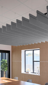 Gray fabric acoustic baffles suspended horizontally from ceiling in modern office space with wooden wall paneling.