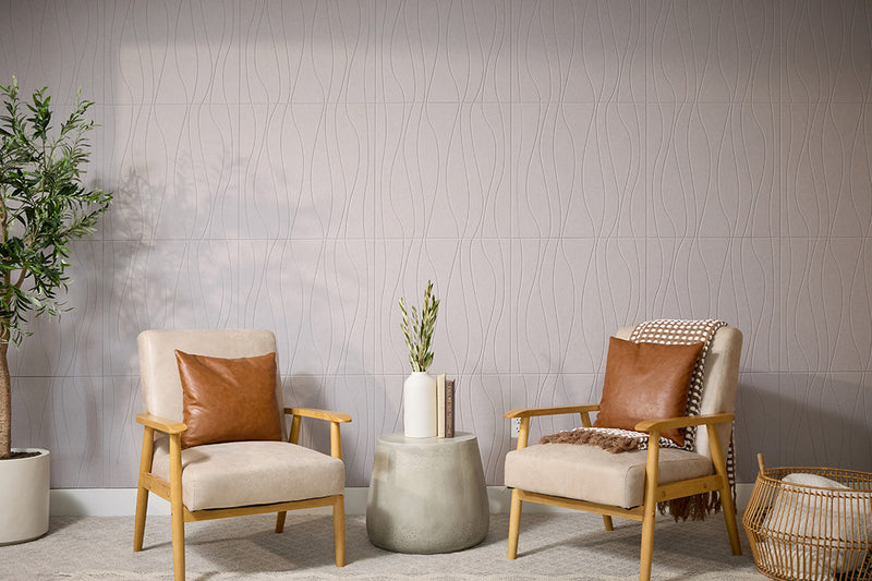 Gray wallpaper alternative PET Felt with vertical wavy line pattern displayed on wall behind two wooden chairs with tan cushions and cognac leather