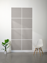 Gray tile with diagonal engraved herringbone pattern arranged in a 2x4 grid on wall.