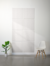 Light gray tile with vertical parallel line engravings arranged in a 2x2 grid pattern on white wall.