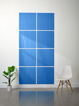 Blue ceramic tiles with vertical engraved lines arranged in offset grid pattern on wall.