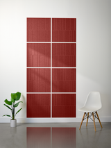 Eight red engraved tiles arranged in a 2x4 grid with offset linear pattern on wall.