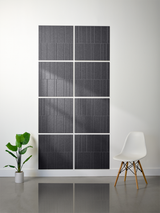Eight dark gray rectangular tiles with vertical engraved line pattern arranged in offset 2x2 grid layout on white wall.