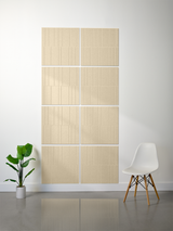 Beige rectangular tiles with vertical line engraving arranged in offset grid pattern on wall.