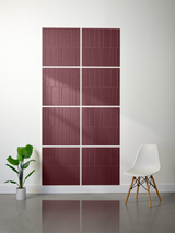 Eight burgundy tiles arranged in a 2x4 grid with engraved vertical line patterns and offset placement on white wall.