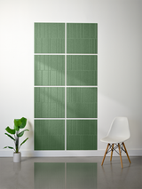 Green rectangular tiles with vertical line engraving arranged in offset pattern on wall.