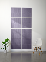 Purple-gray rectangular tiles arranged in offset pattern with vertical line engravings, displayed on wall.
