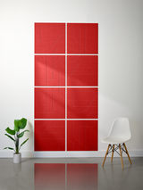 Red subway tile with engraved line patterns arranged in a 2x4 grid display on white wall.