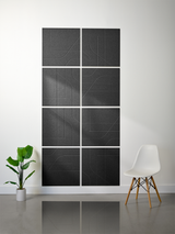 Dark gray subway tiles arranged in a 2x4 grid with engraved curved and linear geometric patterns.