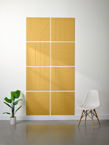 Eight gold subway tiles arranged in a 2x4 grid with engraved geometric line patterns and white grout lines.