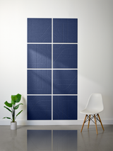Eight dark blue subway tiles arranged in a 2x4 grid with engraved geometric line patterns.
