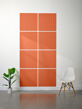 Eight terracotta tiles arranged in a 2x4 grid with engraved vertical lines and curved arc patterns.