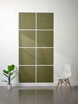 Eight olive green tiles arranged in a 2x2 grid pattern, each with engraved vertical lines and curved geometric designs.