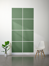 Eight green tiles arranged in a 2x4 grid with vertical line patterns and curved engraved designs.
