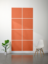 Eight terra cotta tiles with engraved topographic line patterns arranged in a 2x4 grid on a wall.