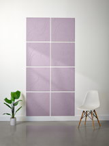 Eight lavender tiles with engraved topographic line patterns arranged in a 2x4 grid on a wall.