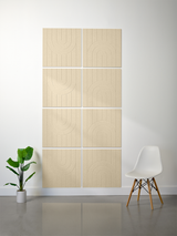 Eight light wood tiles with engraved curved line patterns arranged in a 2x4 grid on a wall.