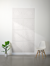 Four light gray tiles arranged in a 2x2 grid with engraved vertical lines and curved arch patterns.