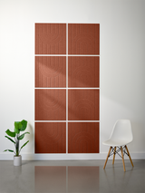 Eight terracotta tiles arranged in a 2x4 grid with engraved geometric arch patterns and vertical lines.