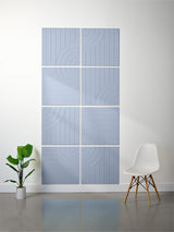 Four blue-gray square tiles with engraved vertical lines and curved tangent arc patterns arranged in a 2x2 grid.