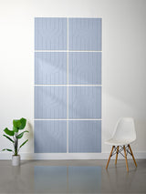 Blue-gray tiles with engraved geometric arch patterns arranged in alternating designs.