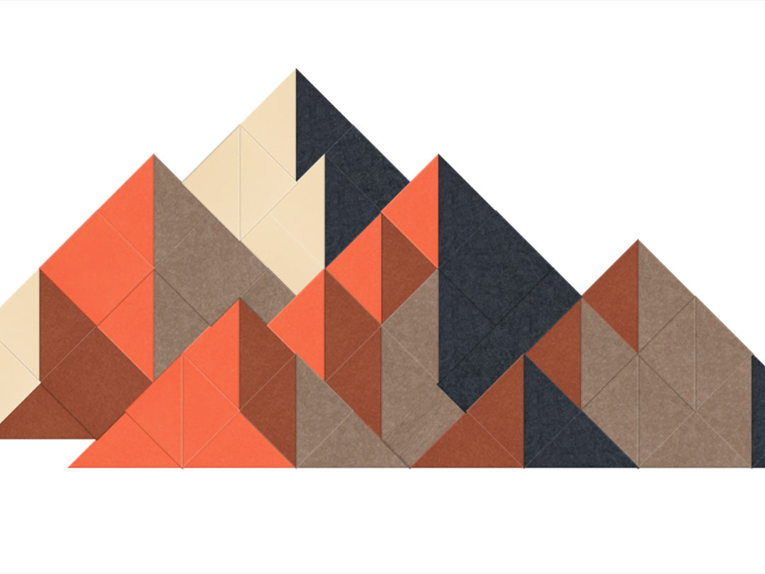 Geometric patterned rug with triangles in various colors on a white background